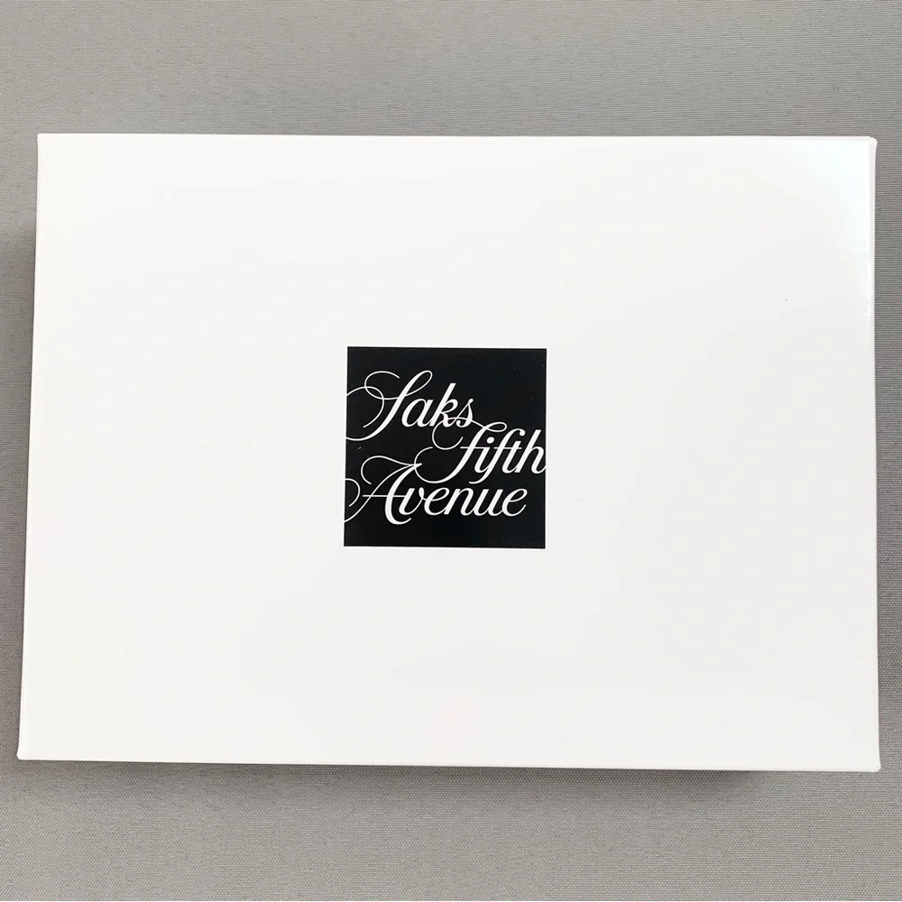 Hold Saks Fifth Avenue gift boxes